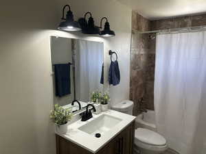Full bathroom with vanity and shower / tub combo with curtain