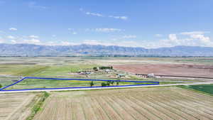 View of mountain backdrop with rural landscape