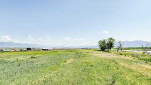 View of yard featuring a view of rural / pastoral area and a mountain view