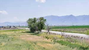 View of mountain background featuring rural landscape