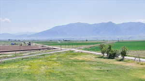 View of mountain backdrop featuring rural landscape