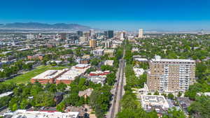 Aerial view of property's location with a mountainous background and nearby urban area