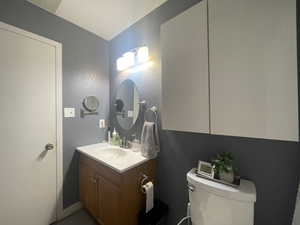 Bathroom featuring vanity and toilet
