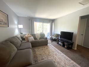 Living area with carpet flooring