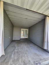 View of patio featuring a carport