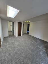 Spare room with carpet floors and a textured ceiling