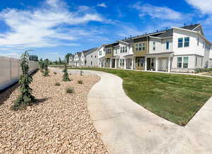 Surrounding community has landscaping finished, this townhome will have the north side completed by July.