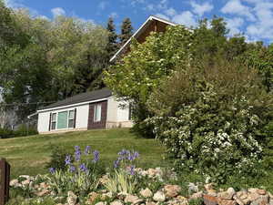 View of front of home with a yard