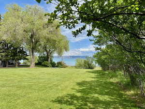 View of grassy yard featuring a water view