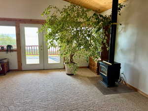 En suite with propane fireplace, vaulted wood ceiling