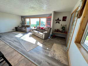 Living area featuring a healthy amount of natural light with lake view