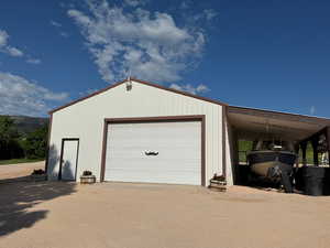 30x36 heated garage with a carport