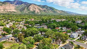 Aerial perspective of suburban area with a mountainous background