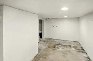 Unfinished basement featuring recessed lighting