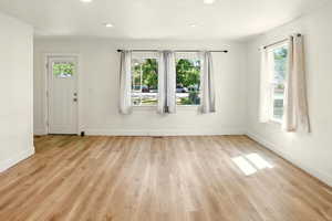 Foyer entrance featuring healthy amount of natural light, light wood-type flooring, and recessed lighting