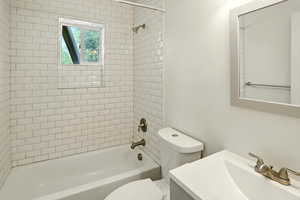 Full bath with washtub / shower combination and vanity