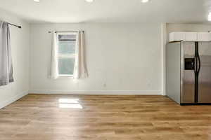 Unfurnished room with recessed lighting and light wood-style flooring