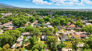 Aerial perspective of suburban area featuring a mountainous background