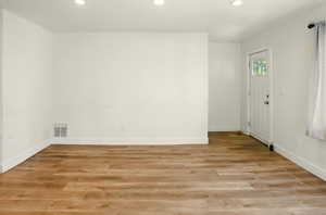 Living room featuring recessed lighting and light wood-style flooring