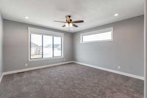 Unfurnished room with ceiling fan, carpet floors, recessed lighting, and a textured ceiling