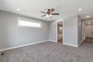 Spare room featuring ceiling fan, recessed lighting, and carpet