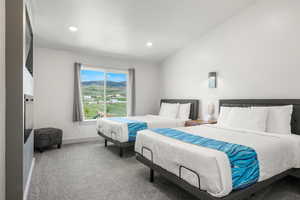 Ensuite bedroom #9 with 2 queen beds, TV, and electric fireplace