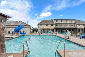 Waterdance Rec Center community pool with a patio and a water slide