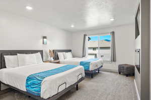Ensuite bedroom #4 with 2 queen beds, TV, and electric fireplace