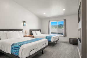 Ensuite bedroom #10 with 2 queen beds, TV, and electric fireplace