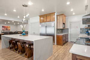Kitchen with 2 refrigerators and 2 ranges