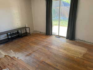 Unfurnished room with hardwood / wood-style flooring