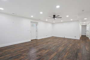 Empty room with dark wood-style flooring, a ceiling fan, and recessed lighting