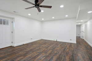 Empty room with dark wood finished floors, recessed lighting, and a ceiling fan