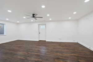 Spare room featuring recessed lighting, dark wood-style floors, and a ceiling fan