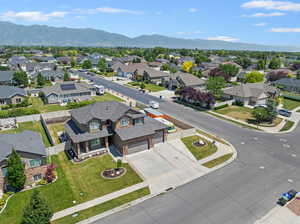 Aerial perspective of suburban area with a mountain backdrop
