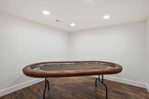Misc room with wood finished floors and recessed lighting