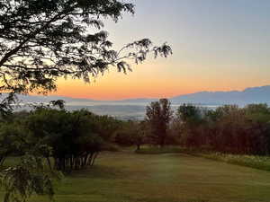 View of grassy yard featuring a mountain view
