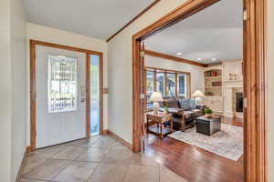 This home boasts many upgrades including hardwood floors and beautiful custom wood doors and trim throughout