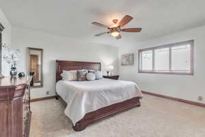 Spacious primary bedroom suite with stunning mountain, valley and lake views