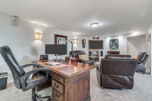 Office featuring light carpet
