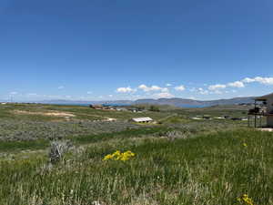 View of mountain backdrop with rural landscape