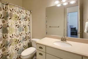 Full bathroom featuring vanity and a shower with shower curtain