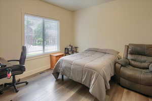 Bedroom with wood finished floors