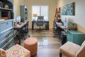 Office featuring wood finished floors and baseboards