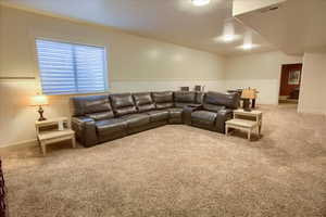 Living room with carpet and baseboards