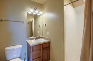 Bathroom featuring vanity and a shower with curtain