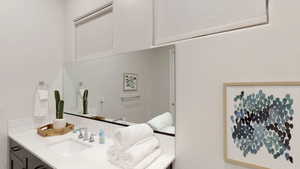 Bathroom with backsplash and vanity