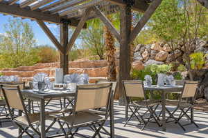 View of patio featuring outdoor dining area and a pergola