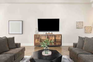 Living room with tile patterned floors and baseboards