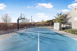 View of tennis court with a pergola
